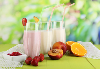 Delicious milk shakes with strawberries and peach