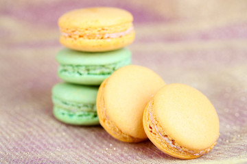 Macaroons on fabric background