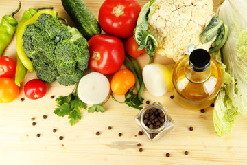 Fresh vegetables in basket on wooden table close-up