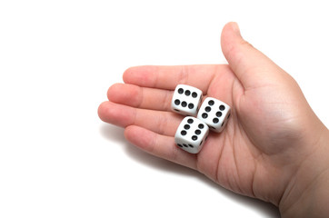 Hand holding three dices