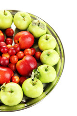 Assortment of juicy fruits on plate, isolated on white