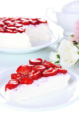 Cheesecake with fresh strawberry on white plate closeup
