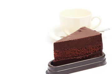 sliced chocolate cake with coffee cup on white background