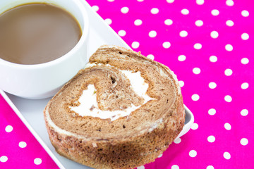 Chocolate roll and coffee cup