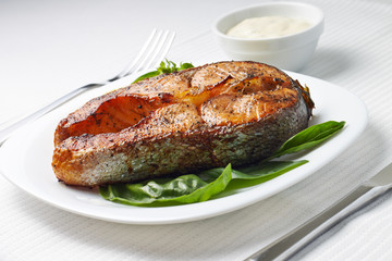 Served Table with Grilled Salmon Steak.