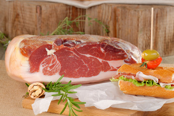 Sandwich with prosciutto on plate