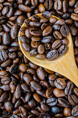 Coffee beans on spoon