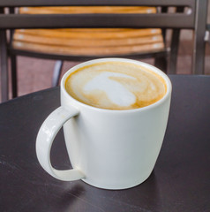 Latte on the black table