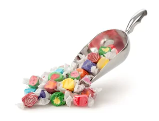 Wall murals Sweets Salt Water Taffy in a scoop isolated