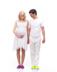 Fototapeta premium A young couple in white clothes waiting for the baby