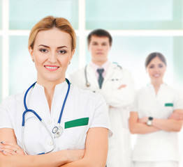 Fototapeta premium A team of young Caucasian medical workers in white clothes
