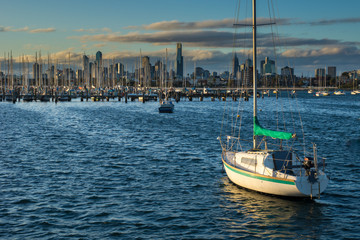 Several Boats docked in front of the Melbourne Skyline