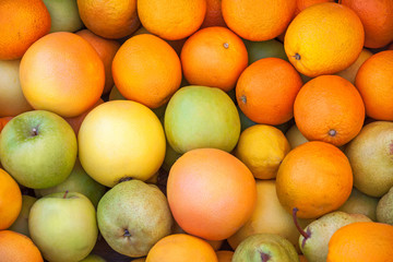 Fresh colorful fruits on the market counter