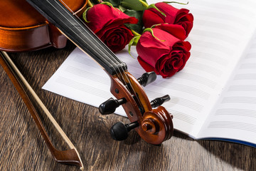 Fototapeta premium Violin, rose and music books