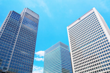 Fototapeta na wymiar The high rise office buildings with blue sky