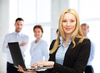 businesswoman with laptop computer at work