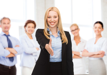 woman with an open hand ready for handshake