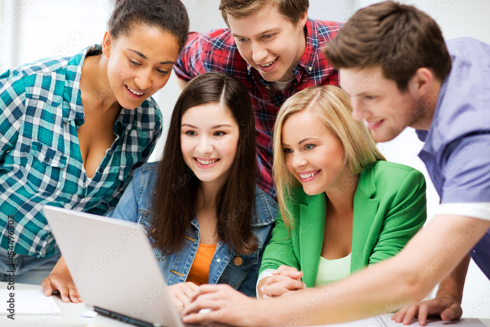 Poster students looking at tablet pc in lecture at school