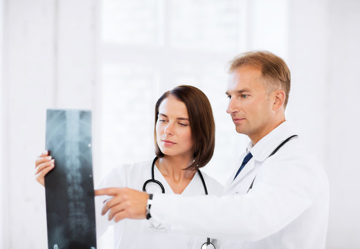 two doctors looking at x-ray