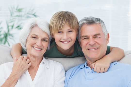 Grandson embracing his grandparents