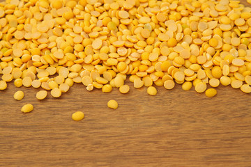 Soy beans on wooden background