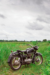 Fototapeta na wymiar Old Motorcycle in Meadow