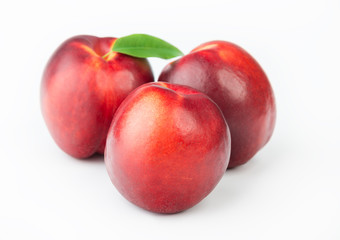 Fototapeta na wymiar Three ripe peaches
