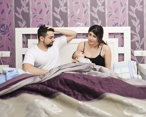 Tired parents with newborn.