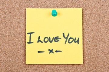 Post it note on wood