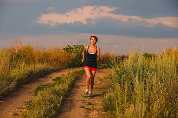beautiful runs healthy young brunette woman athlete running outd