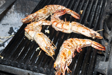 cooking shrimp on the grill in the restaurant