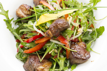 duck with arugula on a white background in the restaurant