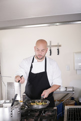 Fototapeta na wymiar chef working and cooking