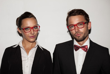 couple of students wearing red glasses