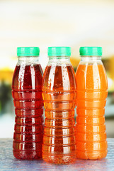 Assortment of bottles with tasty fruit juices