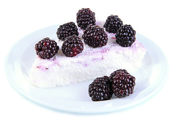 Cheesecake with fresh berries on white plate closeup