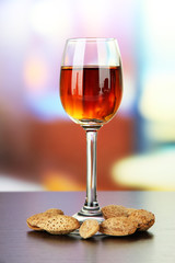 Glass of amaretto liquor and roasted almonds,