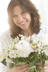 Cheerful Woman Holding Flower Bouquet
