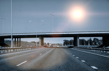 Highway perspective on a sky background