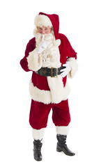 Portrait Of Santa Claus Making Silence Gesture