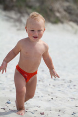 cute boy having fun on beach