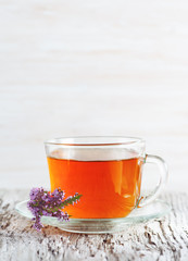 Cup of tea and branch of heather
