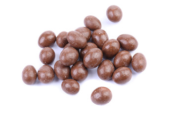 Dark brown dragee, in chocolate covered.