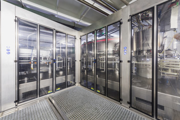 Safety guards with doors in the shop of brewery