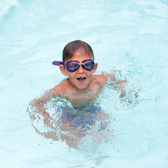 Little boy at the swimming pool