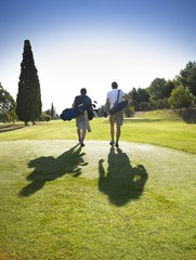 Men walking on golf course