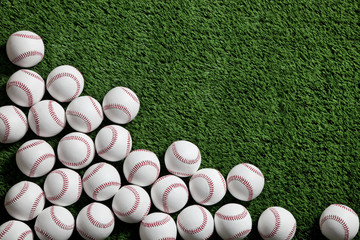 Baseballs on green turf viewed from above