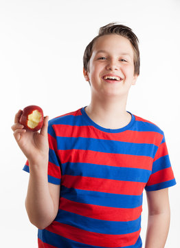 Teenager holding apple into camera