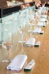 Glasses in the table at cozy cafe with modern interior.