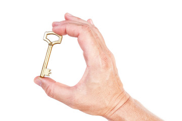 Golden key in hand symbol of the rich house. On a white backgrou